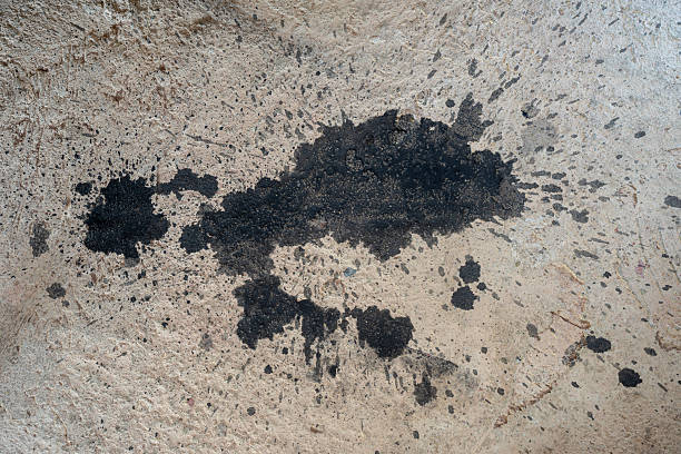 istock Black color paint splash out on the rough concrete floor 2247290646