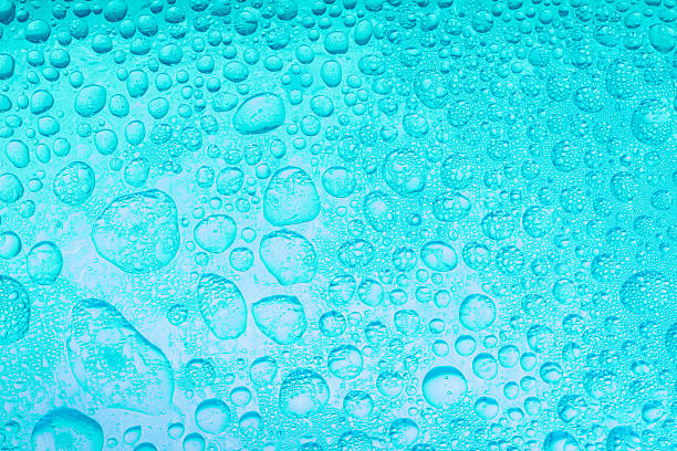 istock The close up image, Texture pattern of water drops over the light blue background 2247290993