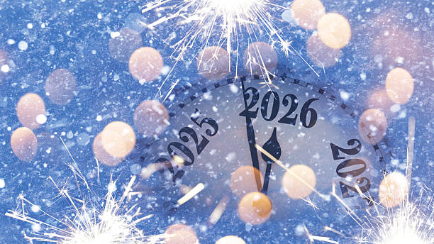 istock Countdown to midnight. Retro style clock counting last moments before Christmas or New Year 2026. Vintage. Vintage watch points to New Year 2026 in snow 2247291060