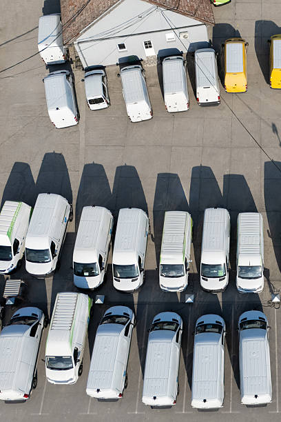 istock Rows of white electric delivery vans at charging stations for electric vehicles. 2247293345