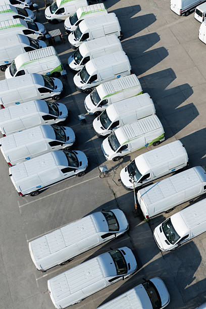 istock Rows of white electric delivery vans at charging stations for electric vehicles. 2247294070