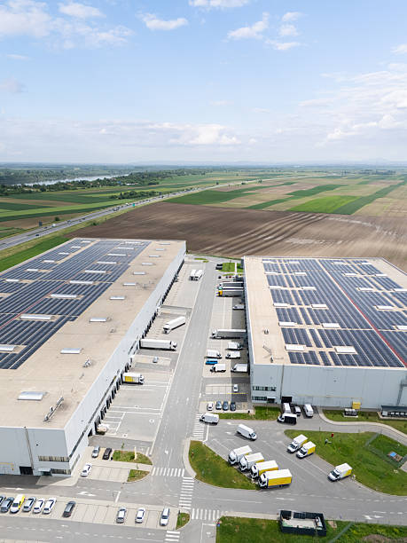 istock Logistics center with solar panels on rooftop. Drone view. 2247294168