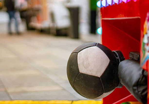 Soccer ball hitting the goal net against blue sky background