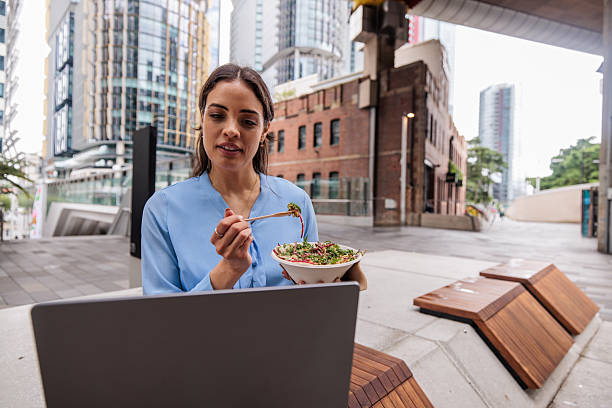 istock Businesswoman Working Outdoors During Lunch Break 2247297078