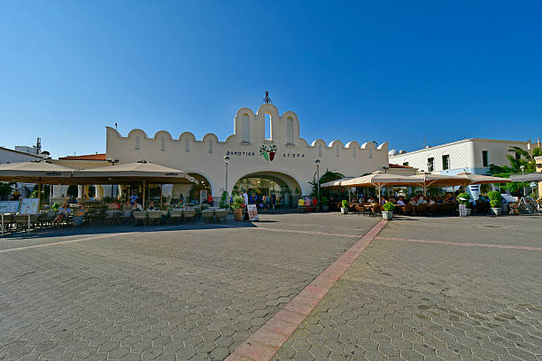 Cos, Greece - September 16, 2025: Public market, shops and restaurants on the Eleftherias Central Square