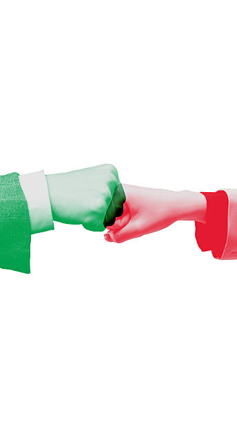 Minimalist poster. Two colored fists touching symbolizing teamwork and mutual support in business partnership. Concept of unity, motivation, collaboration, and corporate communication.