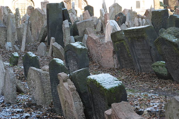 istock Overcrowded Historical Headstones Dusted with Snow at Old Jewish Cemetery 2247298968