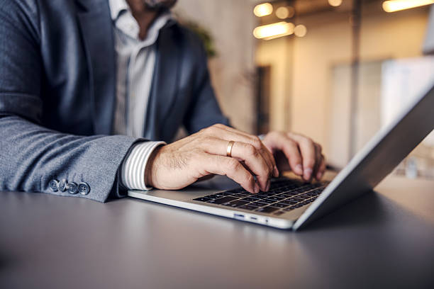 istock Businessman hands typing on laptop keyboard 2247299397