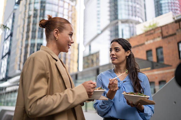 istock Business Colleagues Having Lunch Outdoors 2247300740