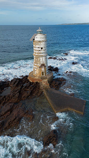 istock Mangiabarche lighthouse on rocky coast near Calasetta Sardinia 2247301290