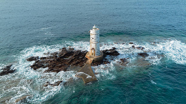 istock Mangiabarche lighthouse on rocky coast near Calasetta Sardinia 2247301399