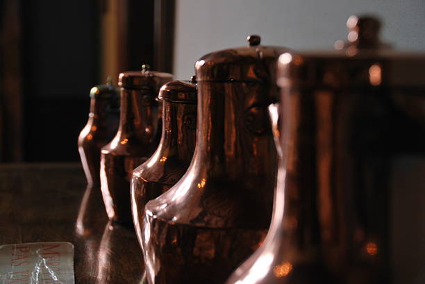 istock Row of Polished Antique Copper Coffee Pots 2247302300