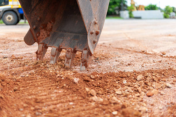 istock Heavy machinery excavation close-up earth digging at industrial construction site 2247303252