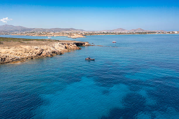 istock Boat on Turquoise Waters Near Paros, Greece 2247304067