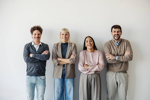 istock Diverse business team standing confidently with folded arms 2247304263