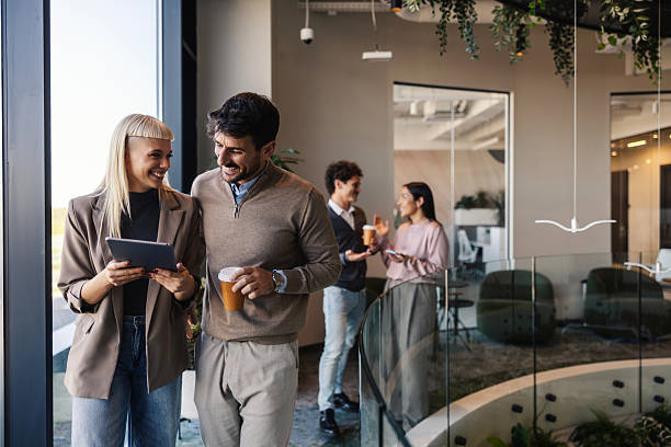 istock Business people collaborating with tablet in modern office 2247304349