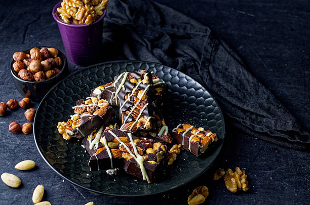 Dark Chocolate Nut Bark on Black Textured Plate – Gourmet Comfort Food