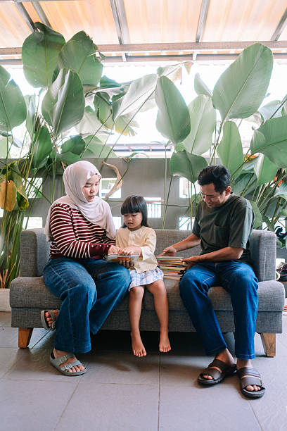 istock Parents and child enjoying storytime together in a natural setting 2247309982