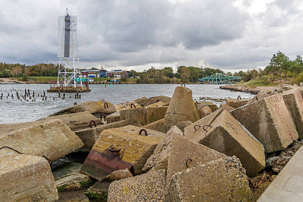 istock Navigation Tower and Bridge with Concrete Coastal Blocks 2247312244