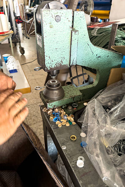 istock Manual grommet press machine used in industrial textile workshop 2247313295