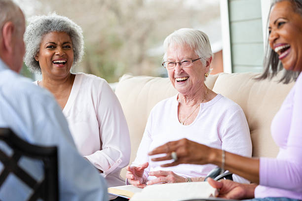 istock Diverse group of seniors enjoying laughter and conversation outdoors on a bright day. 2247313912