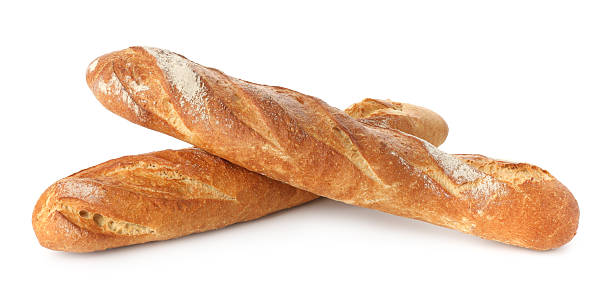 istock Freshly baked bread. Baguettes isolated on white 2247314631