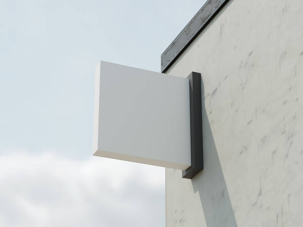 istock Hanging store sign mockup on a textured wall with shadows and ambient light 2247316234
