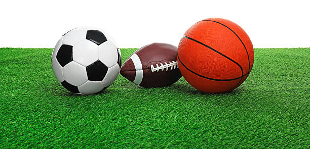istock Different balls on artificial grass against white background. Sport equipment 2247316534