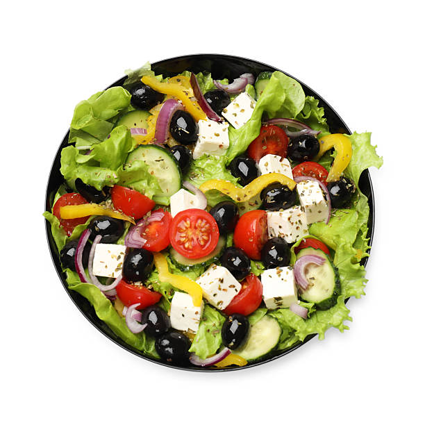 istock Delicious fresh Greek salad isolated on white, top view 2247317480