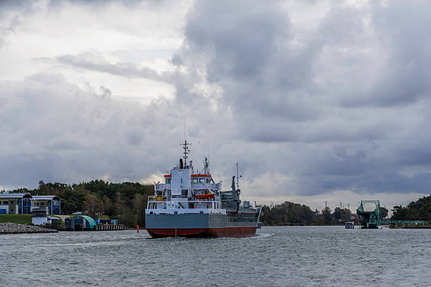 istock Freighting Vessel Entering or Leaving Port Through Channel 2247319030