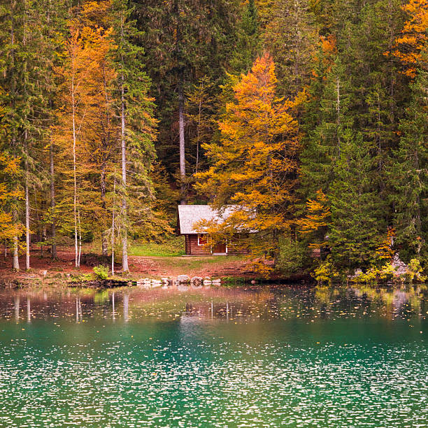 An easy walk along the shores of the Fusine Lakes. The colors of autumn and a light rain shower.