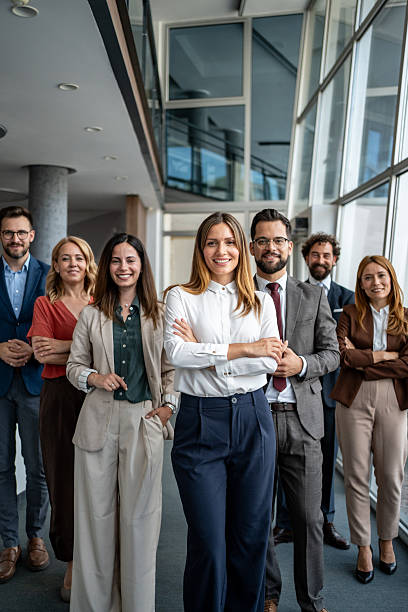 istock Confident business team standing together in office 2247320438