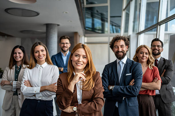 istock Diverse business team smiling with crossed arms in office 2247320509