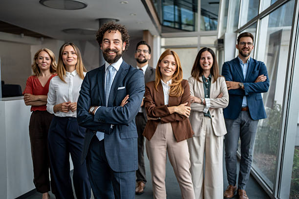 istock Confident business team standing together in modern office 2247320546
