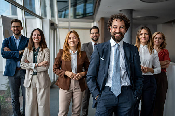 istock Business professionals standing in office looking at camera 2247320557