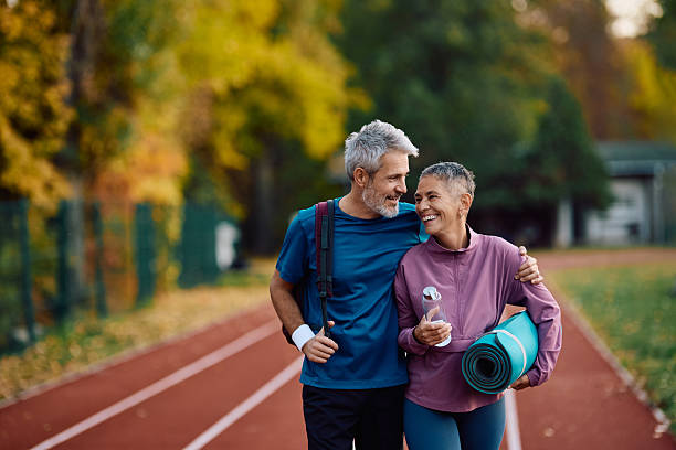 istock Happy mature athletic couple talking while going on sports training at the park. 2247320676