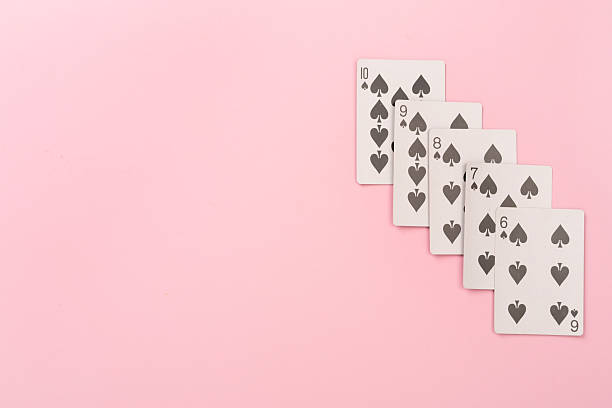 Poker chips and playing cards on color background, top view. Casino card game
