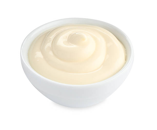 istock Tasty mayonnaise sauce in bowl isolated on white 2247324940