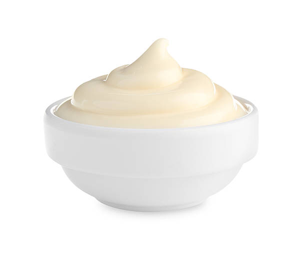 istock Tasty mayonnaise sauce in bowl isolated on white 2247324977