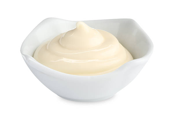 istock Tasty mayonnaise sauce in bowl isolated on white 2247324980