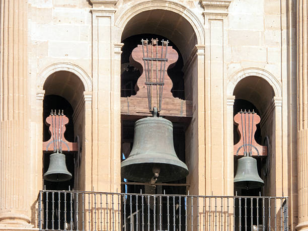 Three bells on the bell tower of Malaga Cathedral, Andalusia, Spain:
