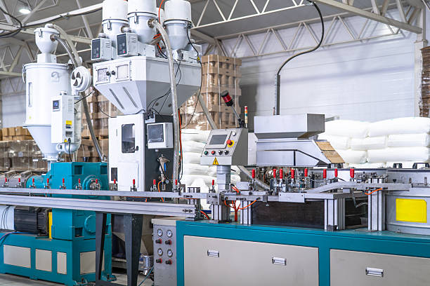 istock Industrial plastic extrusion machine in modern factory, automated production line with control panel, pneumatic system and material feeders, plastic processing equipment for manufacturing 2247336180