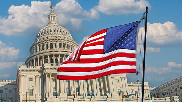 istock American Flag in front of The Capitol 2247338550