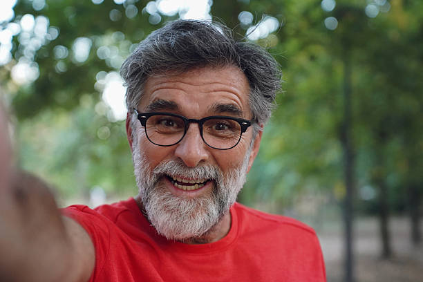 istock Senior man taking a selfie in the park after a workout 2247340817