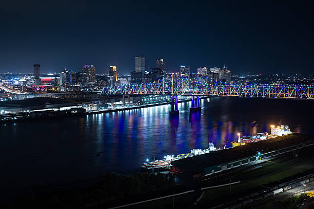 Aerial shot of the crescent city connection bridge and downtown New Orleans, Louisiana at night
