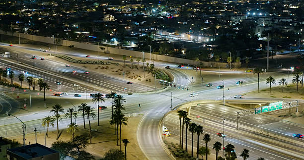 Aerial shot of Papago Freeway on a clear night in Phoenix, Arizona.- Authorization was obtained from the FAA for this operation in restricted airspace.
