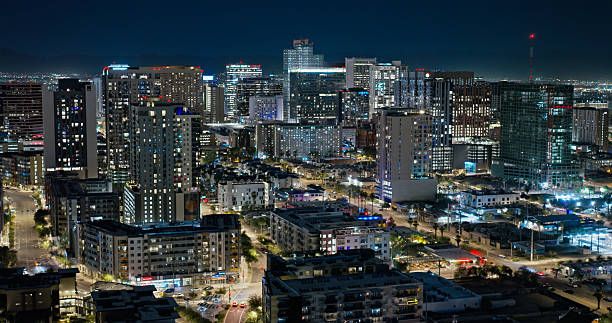 Aerial shot of Downtown Phoenix, Arizona on a clear night.- Authorization was obtained from the FAA for this operation in restricted airspace.