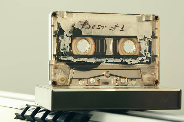 Audio cassette mix tape on a boom box retro cassette player from 90's
