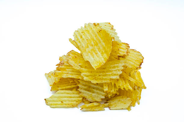 istock Stacked Ruffled Potato Chips with Golden Brown Edges on Black Background crisps snack, 2247348048