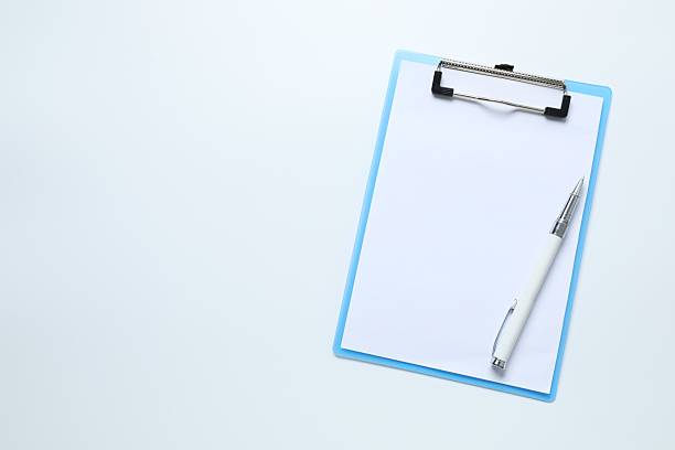 istock Clipboard with paper sheet and pen on white background, top view. Space for text 2247353551